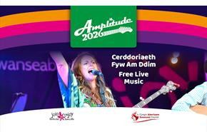 Amplitude 2026 - A singer on stage holding a guitar and singing into a microphone., with logos and graphics overlaid